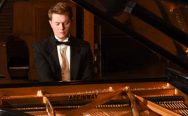 Photo showing student playing Steinway