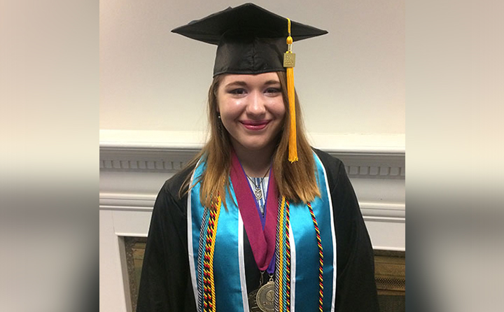 Photo of Tessa (Smith) Fenstermaker in graduation gown