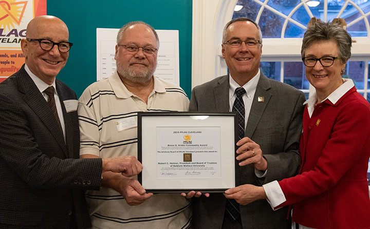 BW President Bob Helmer accepts the 2019 Bruce G. Kriete Community Award from PFLAG Cleveland officers (left to right) Frank Groh-Wargo, president, Tom Falcone, board member, (Pres. Helmer) and Dr. Sh
