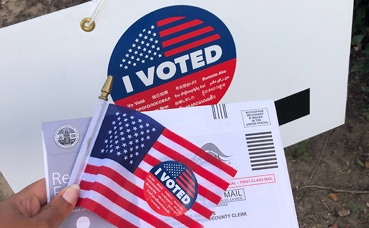 "I voted" sticker, ballot and American flag