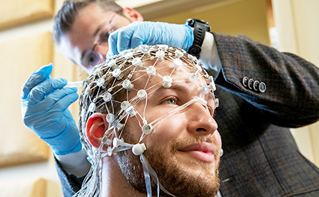 photo of Dr. Patrick Ledwidge using EEG in Cognitive Neuropsychology Lab