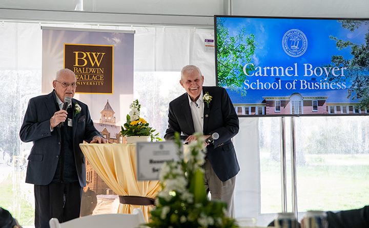 Willard E. “Bill” Carmel ’52 (left) and George T. Boyer ’51 (right) thank the crowd at the naming of the BW Carmel Boyer School of Business. Carmel admitted, “When I learned the School of Business wou