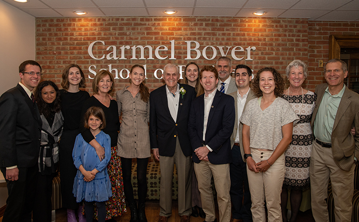 Boyer, (center wearing corsage) surrounded by members of his family at the April 29 event to celebrating the naming of the BW Carmel Boyer School of Business.