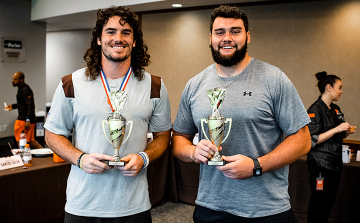The judges crowned center Brock Hoffman (right) winner of the stir-fry competition, with linebacker Silas Kelly (left) finishing first in the dessert category. (Photo courtesy the Cleveland Browns)