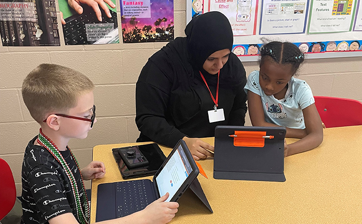 The high dosage tutoring program is mutually beneficial for BW education majors, like Emily Yasin (center), and the elementary school students they work with.