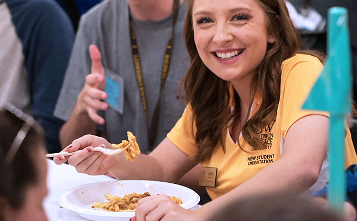 Image of Student Eating Pasta