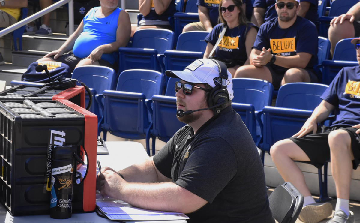 Alex Dettmer calls softball