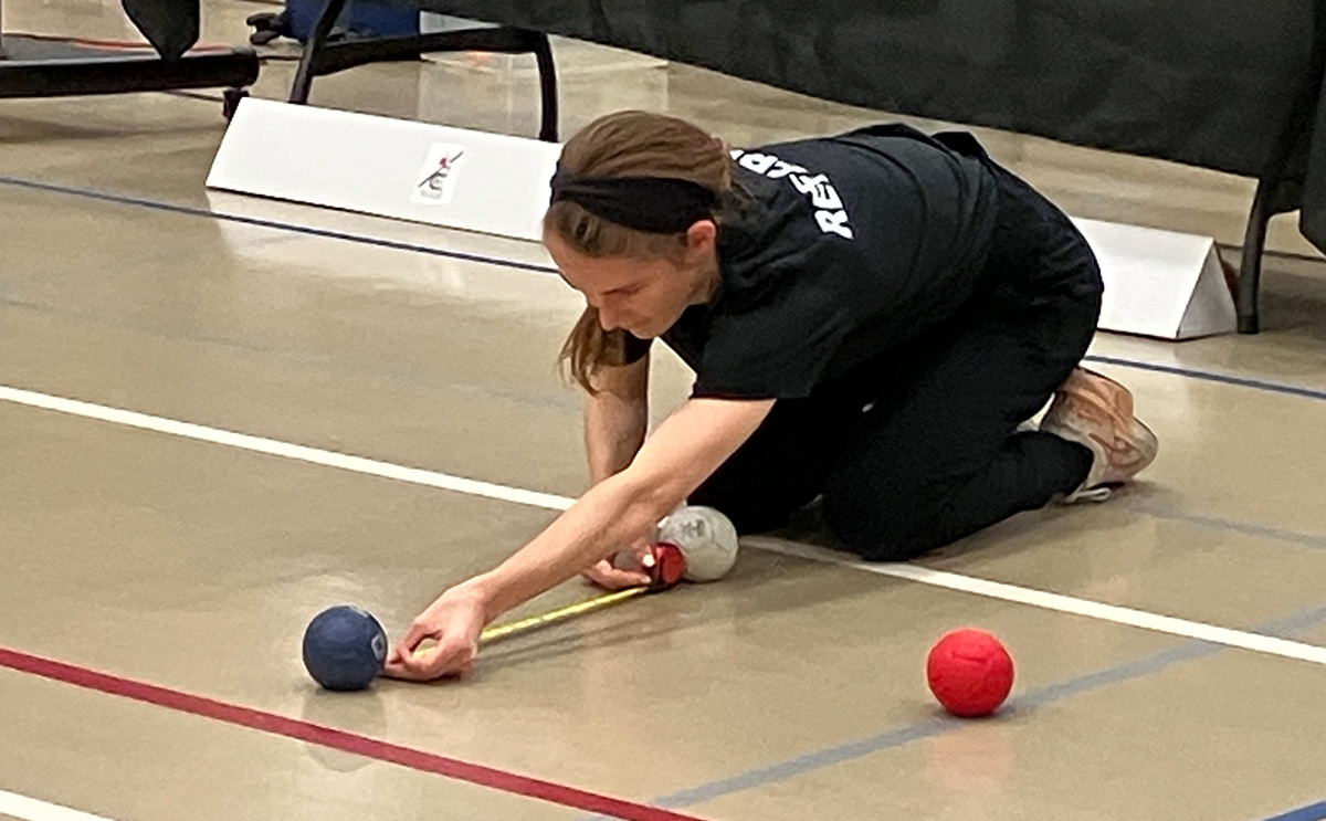 Boccia regional tournament referee measures distance