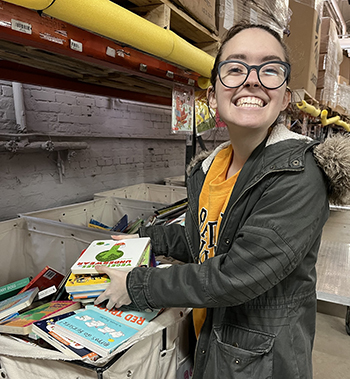 A BW CKI student volunteer sorts books