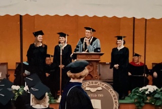 President Neal Malicky recognizes Dar Marlink and her twin daughters .
