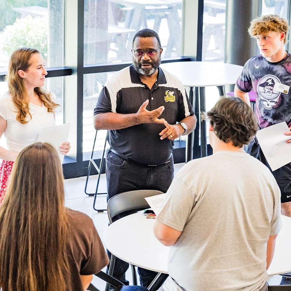 Professor and students in BW's computer science program