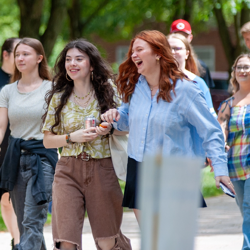 Students taking a stroll down the Grand Walkway on South Campus.