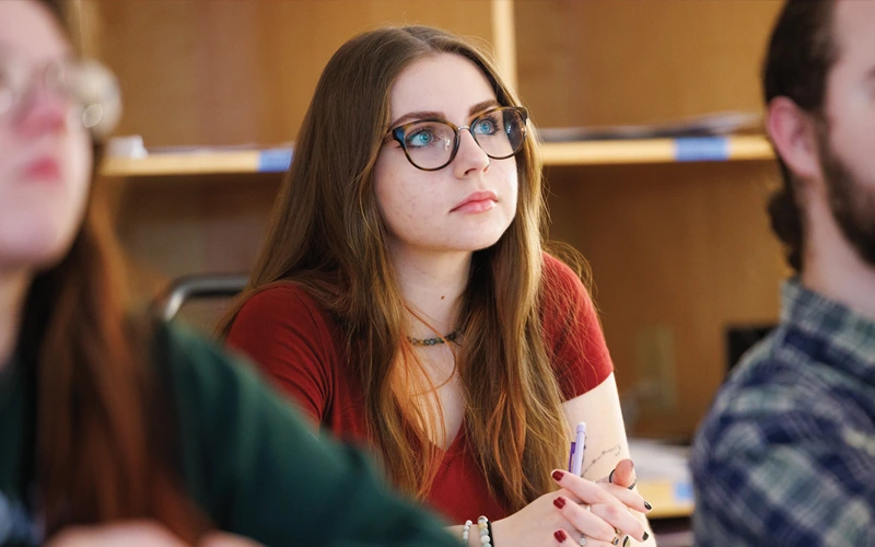 A BW student listening intently and looking interested during a class.