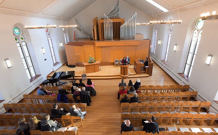 The pipes of the multiple-story 1964 Cassavant pipe organ draw the eye upward to the ceiling’s hand-painted “Canopy of Heaven.”