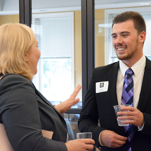 Photo of two professionals talking to each other