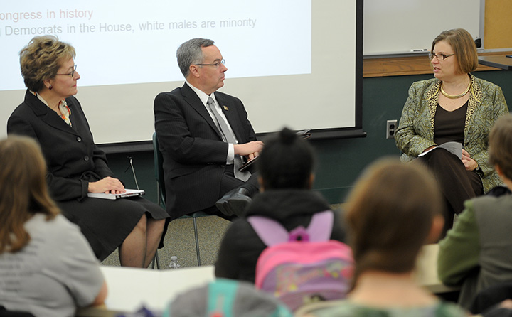 photo: Marcy Kaptur, Bob Helmer and Barb Palmer speaking to a BW class