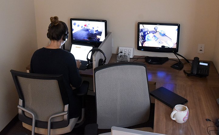 A student in the observation room at the BW Speech Clinic.