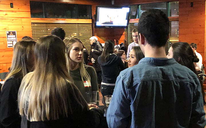 Photo of students networking at a Graduate Student Association event