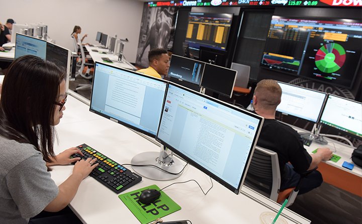 Student at computer in Business Research Center