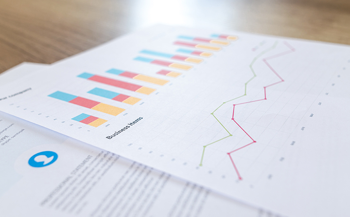 Photo of printed charts and documents on a table