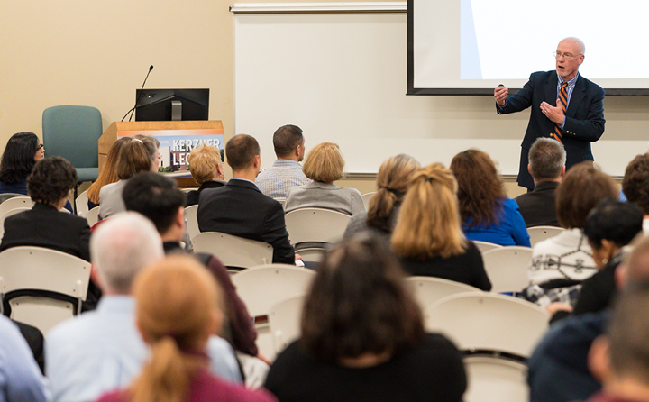 Photo of man giving a lecture to a group