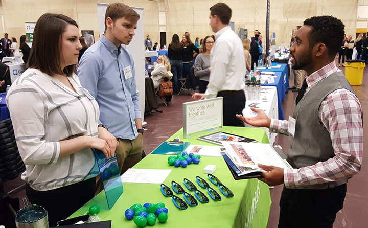 Photo of people talking at a career fair