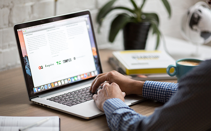 Photo of person using a laptop