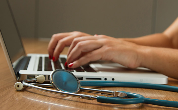 Image of stethoscope and laptop