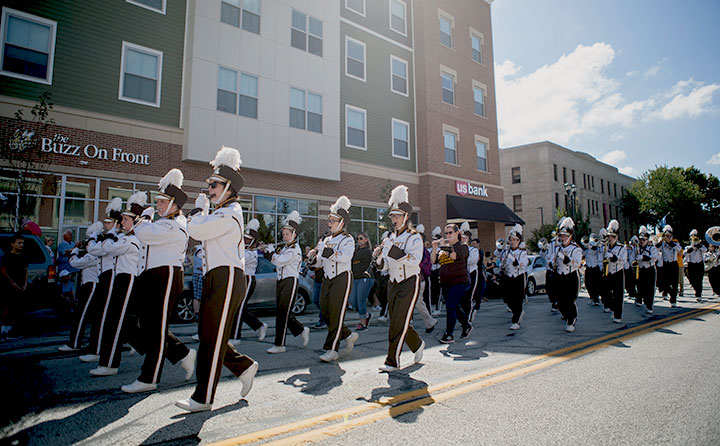 The Yellow Jacket Marching Band parades down Front Street for BW's Bold & Gold Homecoming.