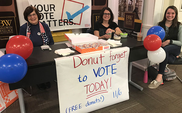 Volunteers hand out donuts on election day