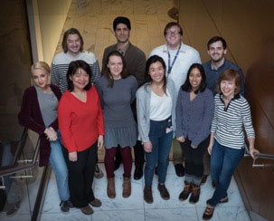 Photo of Dr. Paweletz (left rear) and his research team at the Dana-Farber Cancer Institute's Belfer Center for Applied Cancer Science