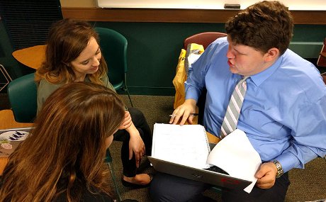 Maddie Brotzki (l), a senior political science major from Amherst, Ohio and Jack Smith (r), a senior political science and history double major from Parma, Ohio, analyze data with from a BW CRI survey