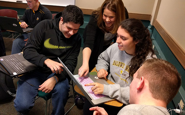 Students Bryan Istenes, Holly Lisco, and Anthony Kukura with Dr. Lauren Copeland.