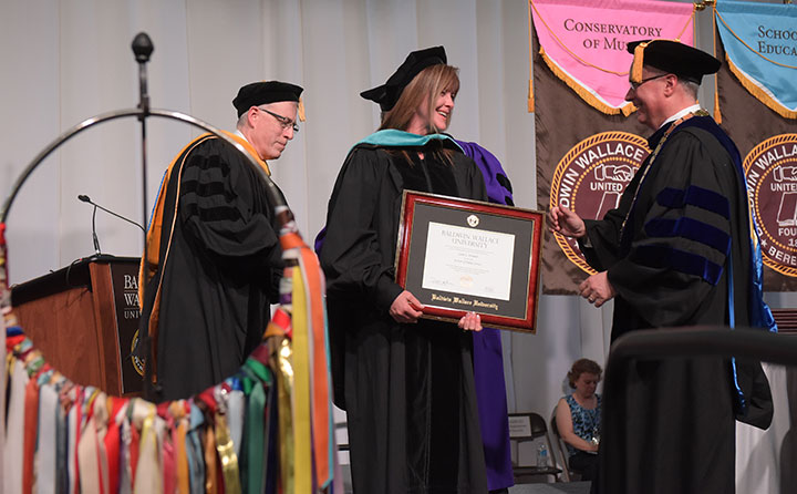 Commencement speaker, Dr. Janet L. Kavandi, director of the NASA Glenn Research Center in Cleveland, receives an honorary doctorate from BW.