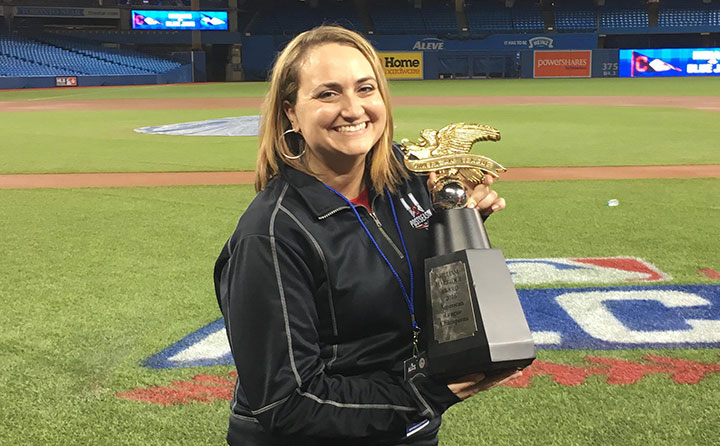 Baldwin Wallace graduate Penny Forster with the 2016 American League championship trophy