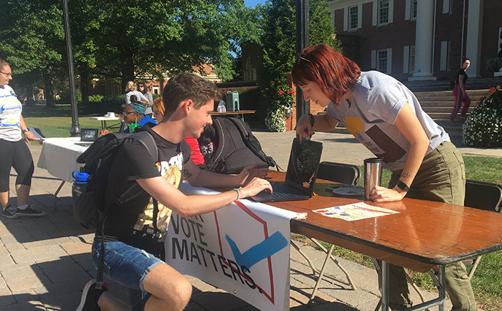 Ally Crays registers a fellow student  to vote as part of the ongoing "Jackets Engaged" initiative. 