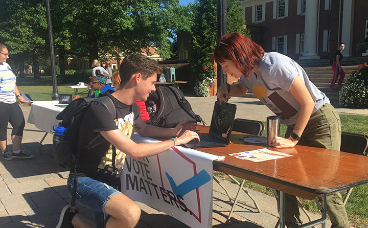 Ally Crays registers a fellow student to vote as part of the ongoing "Jackets Engaged" initiative. 