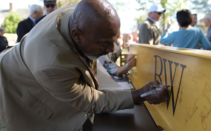 The BW community was invited to sign a gold beam that will be part of the Knowlton Center.