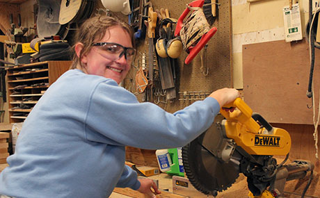 Photo of Julie Simmons doing construction work