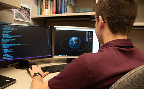 Photo of Lucas Shalkhauser '21 working at a computer