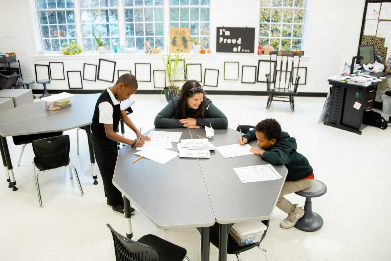 Photo of Kay Low teaching students at I Promise