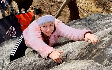 photo of outdoor activity showing a Baldwin Wallace student rock climbing