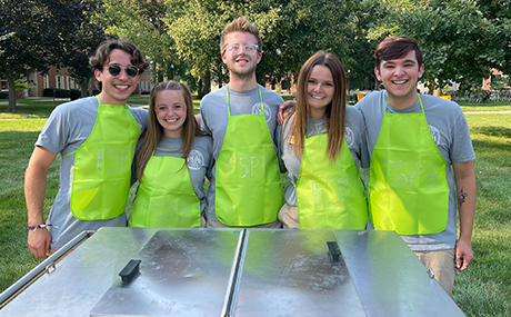 Jordyn Rozek (2nd from right) and fellow members of the BW Fraternity Sorority Programming Board prepare to serve ice cream during BW Week of Welcome.