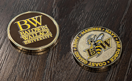 Front and back views of BW's custom "challenge coin"