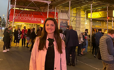 Isabella Shiavon standing in front of the broadway building