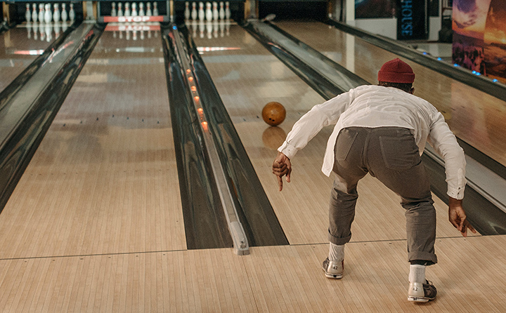 Bowler watches ball