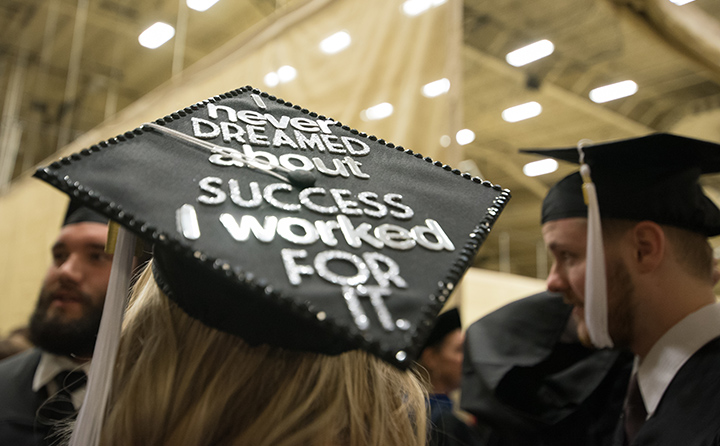Commencement cap with message about hard work