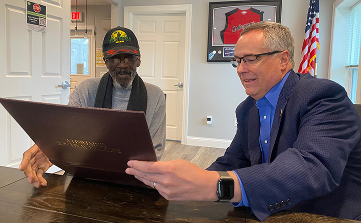 Darnell Worley (left) and BW President Bob Helmer (right) at a special graduation ceremony for the 81-year-old Army veteran.