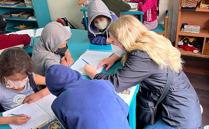 photo of BW student Kaylee McGee with school children