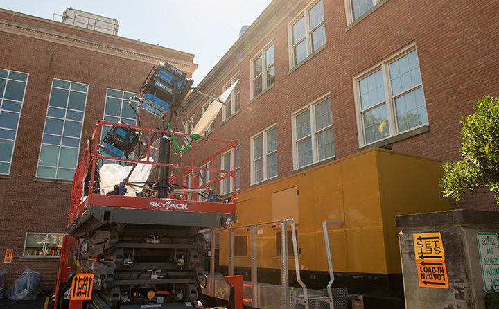 Film equipment set up outside Wilker hall to create proper lighting